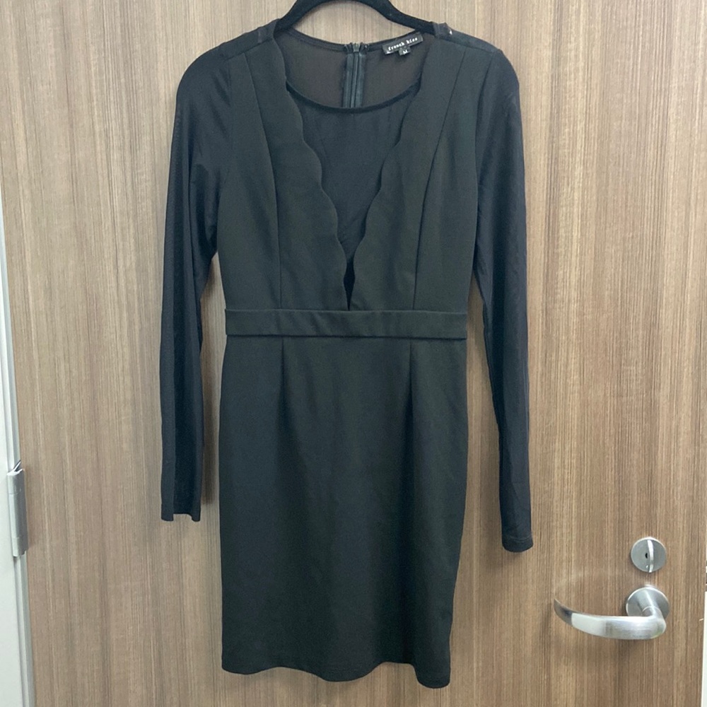 French Kiss black dress with some shear areas. Scalloped edge around front.